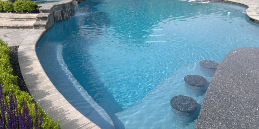 Build a Rock Wall Along a Section of Your Pool 