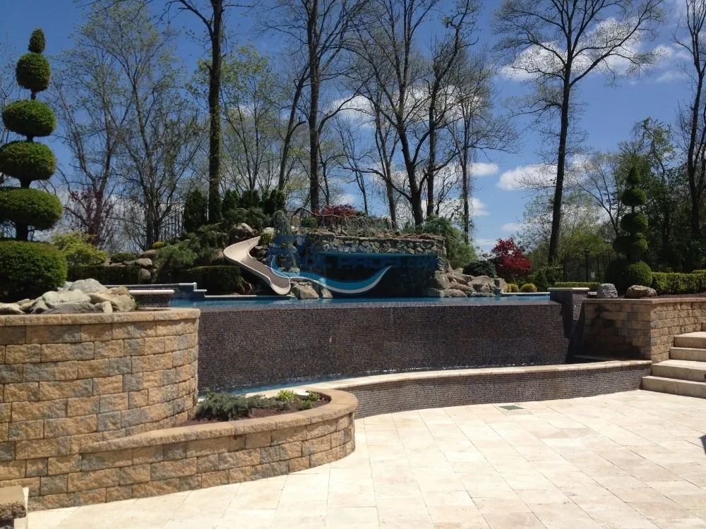 custom slide & grotto installation in Cresskill, NJ, swimming pool construction nj